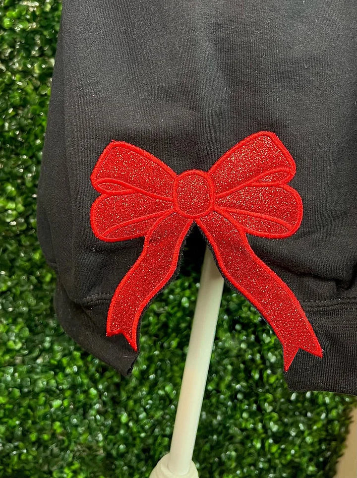 Gepersonaliseerde geborduurde teamtrui met strik aan de zijkant en glitter