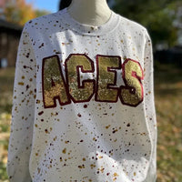 Kundenspezifisches, handgefertigtes Shirt mit Punkt-Maskottchen und Sweatshirt mit Pailletten-Stickerei und Teamnamen